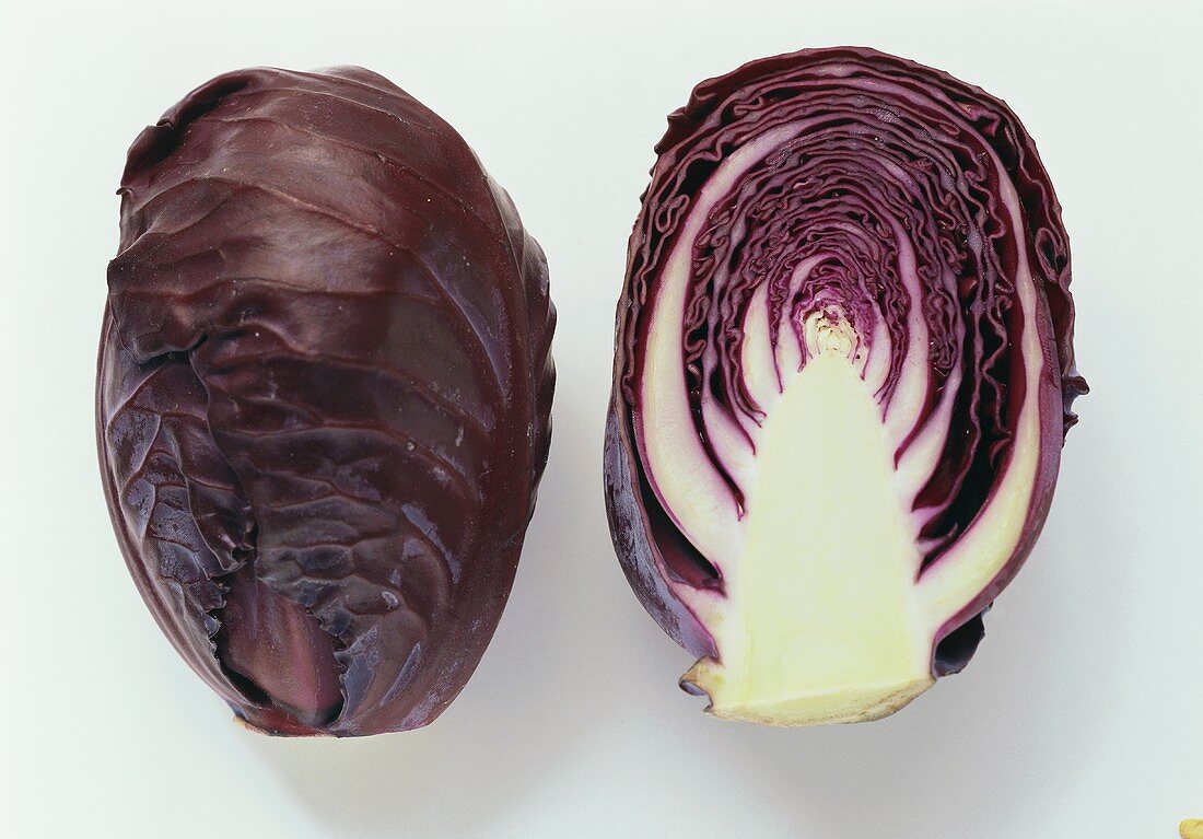 A whole and a half mini-red cabbage 