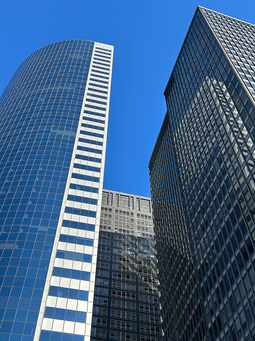 Low angle view of two modern skyscrapers, Financial District, New York City, New York, USA