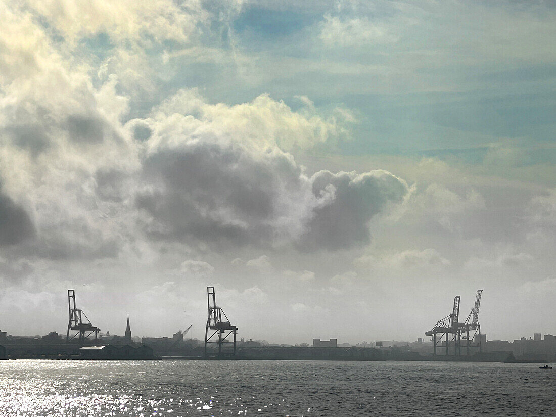 Silhouette of Red Hook container terminal and waterfront with dramatic sky, Brooklyn, New York City, New York, USA