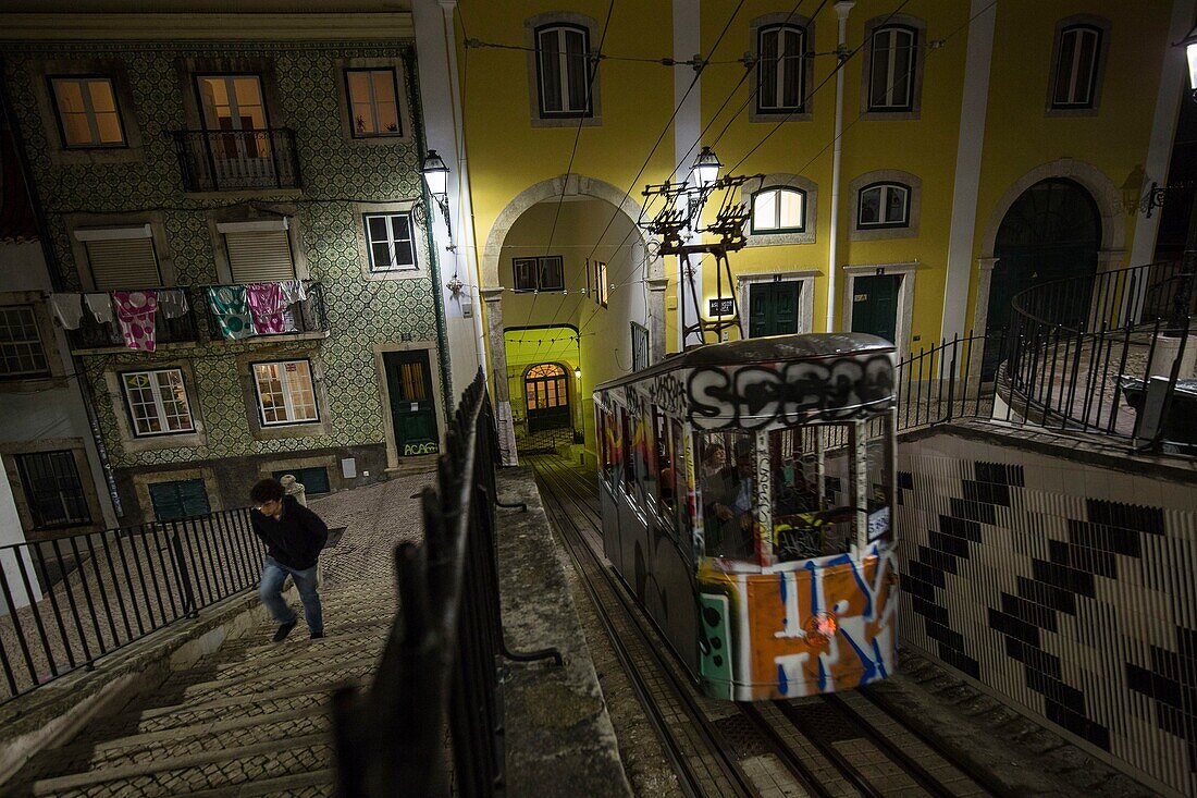 Portugal, Lisbon, Bica district, Bica funicular going up Duarte Belo da Bica street