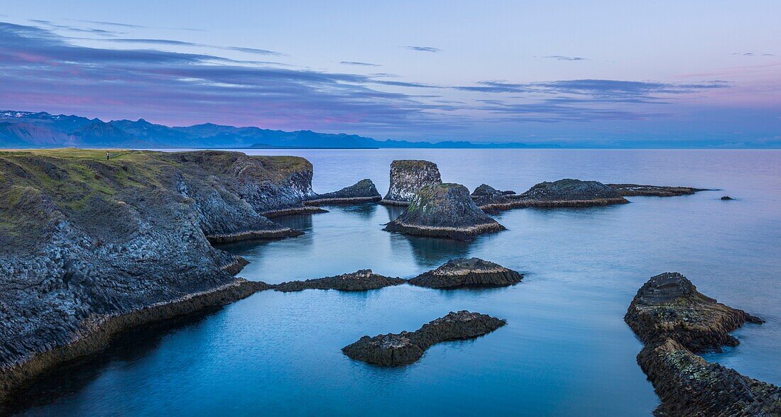 Iceland, Western Region, Grundafjordur, Arnarstapi, Snaefelness cliffs at sunset