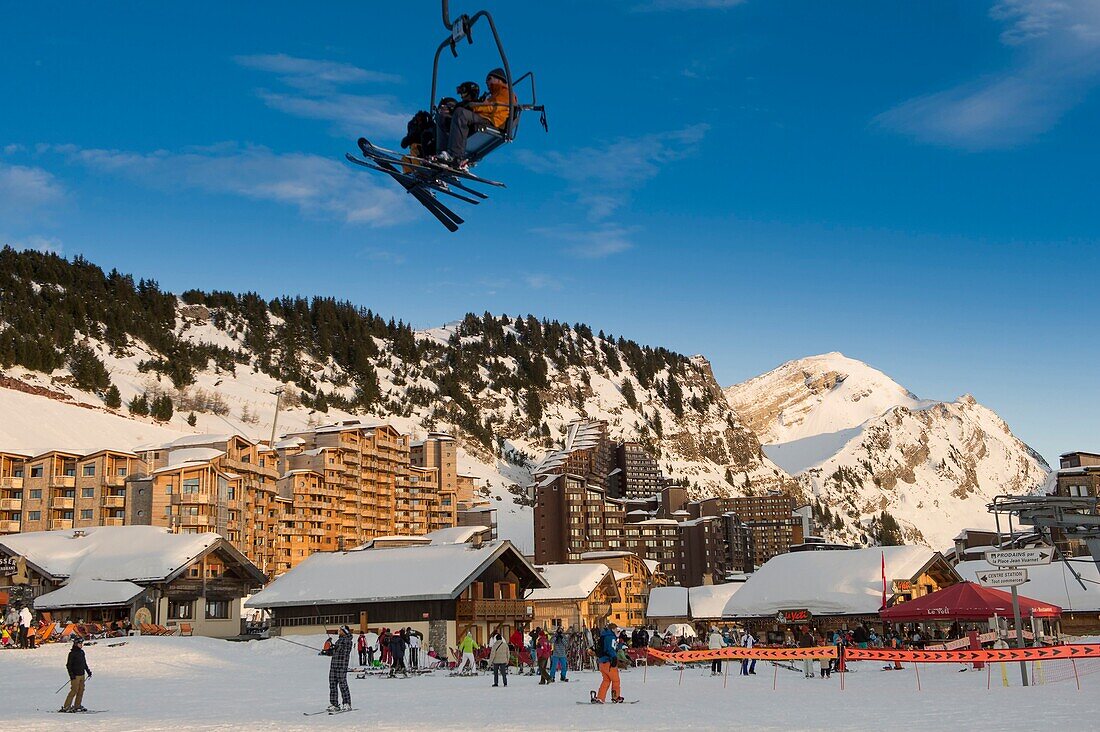 France, Haute Savoie, Chablais massif, Portes du Soleil ski area, Avoriaz, Front of snow entrance station and chairlift of Plateau at sunset