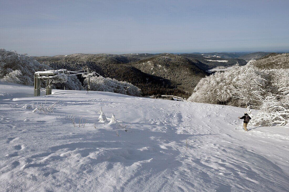 France, Vosges, Hautes Vosges, from the Route des Cretes, to the Hohneck, ski liftshoe hiker, view over the valley of the lakes, Longemer lake