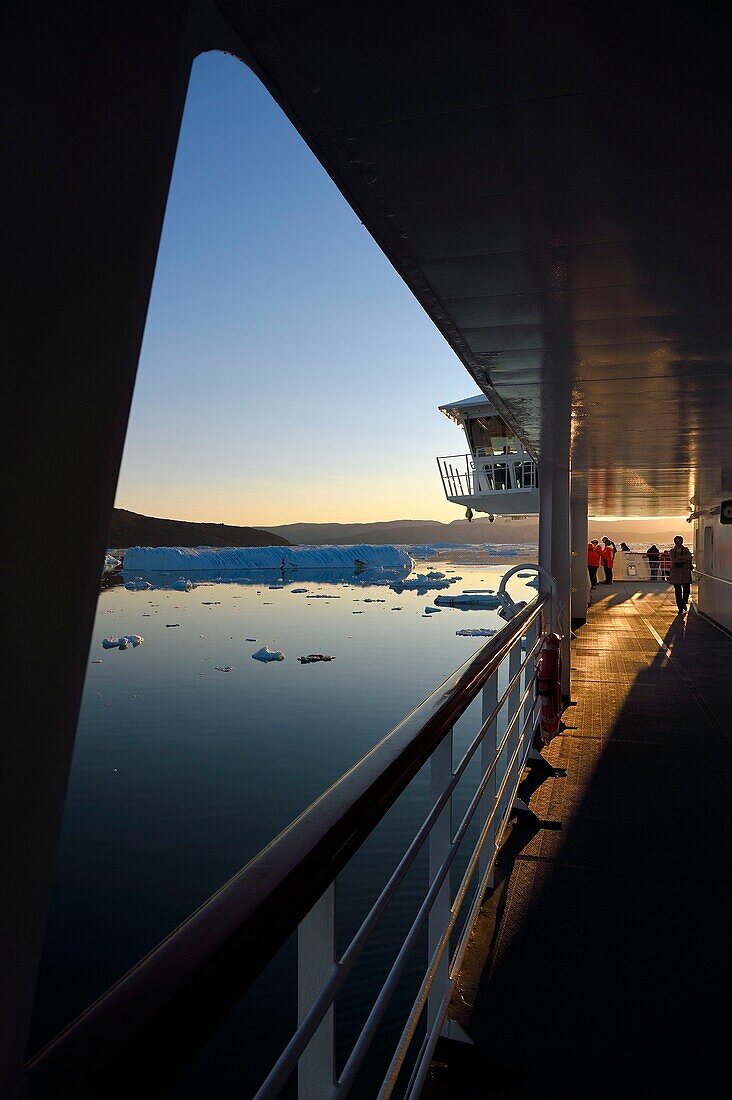 Greenland, west coast, Disko Bay, Hurtigruten's MS Fram Cruise Ship moves between Icebergs in Quervain Bay