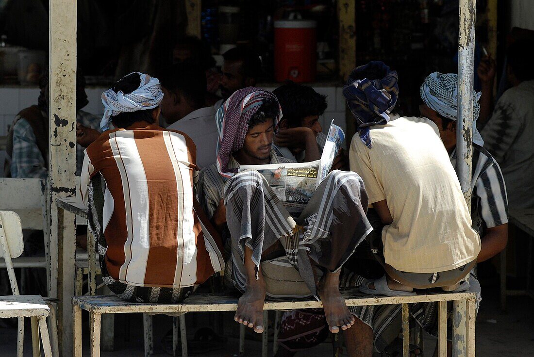 Yemen, Hadhramaut Governorate, Seyoun, small souk, men reading and talking