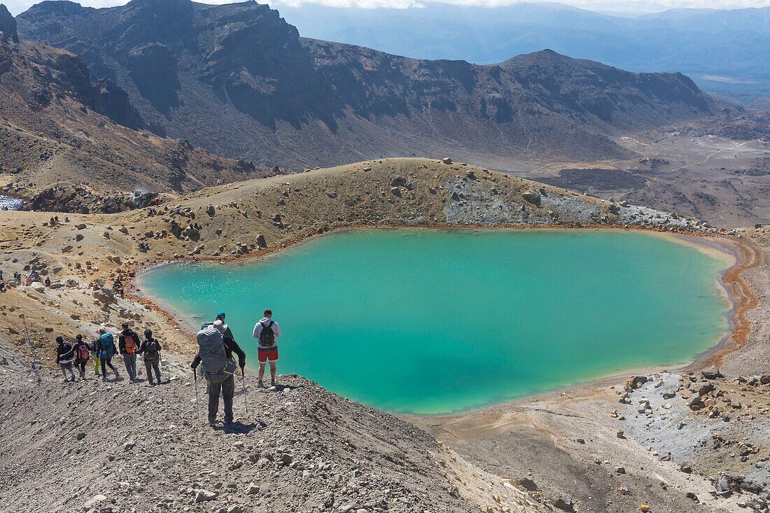 New Zealand, North Island, Waikato region, Tongariro National Park, 1967 m, labelled Unesco World Heritage Site, hikers on the Tongariro Alpine crossing near Emerald Lake