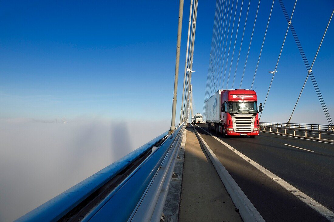 France, between Calvados and Seine Maritime, the Pont de Normandie (Normandy Bridge) spans the Seine in the Fog