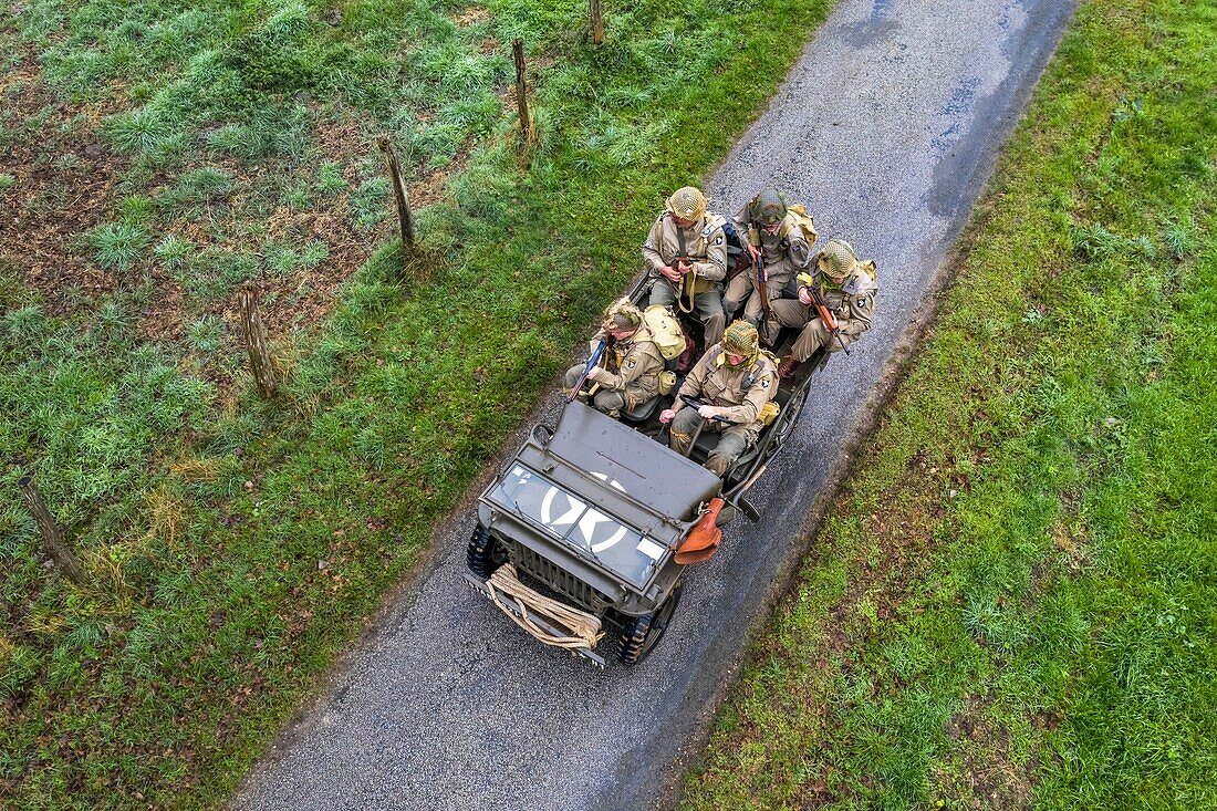 France, Eure, Sainte Colombe prés Vernon, Allied Reconstitution Group (US World War 2 and french Maquis historical reconstruction Association), reenactors in uniform of the 101st US Airborne Division progressing in a jeep Willys (aerial view)