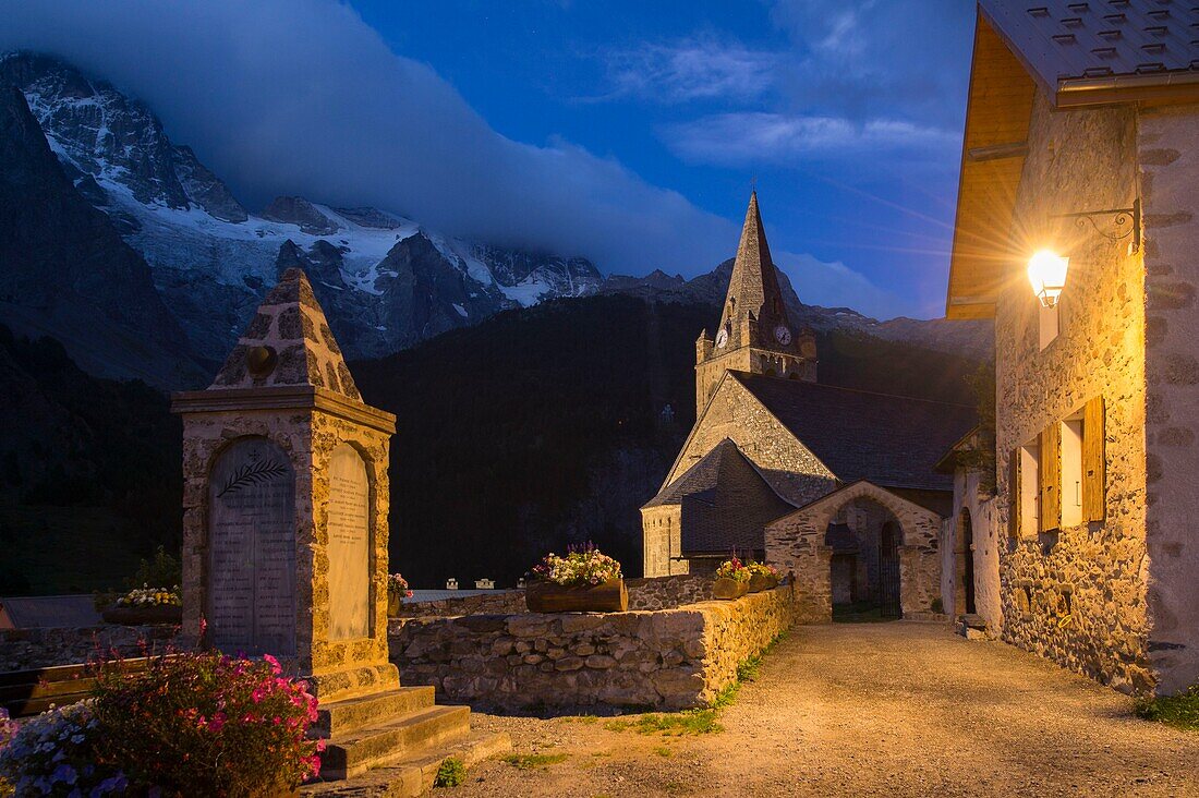 France, Hautes Alpes, The massive Grave of Oisans, dusk on the church facing the Meije