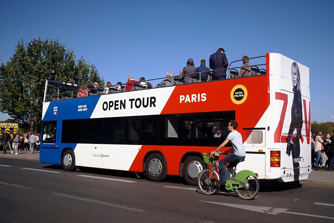 France, Paris, area listed as World Heritage by UNESCO, Double decker tourist bus on the banks of the Seine