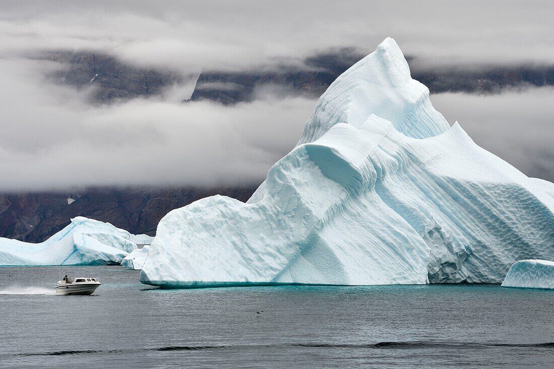Greenland, West Coast, Baffin bay, fishing in front of icebergs in Uummannaq fjord