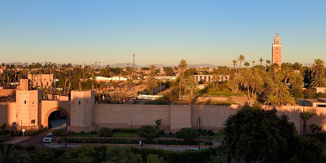 Morocco, High Atlas, Marrakech, Imperial city, Medina listed as World Heritage by UNESCO, the ramparts of the city and the minaret of the Koutoubia mosque in the background