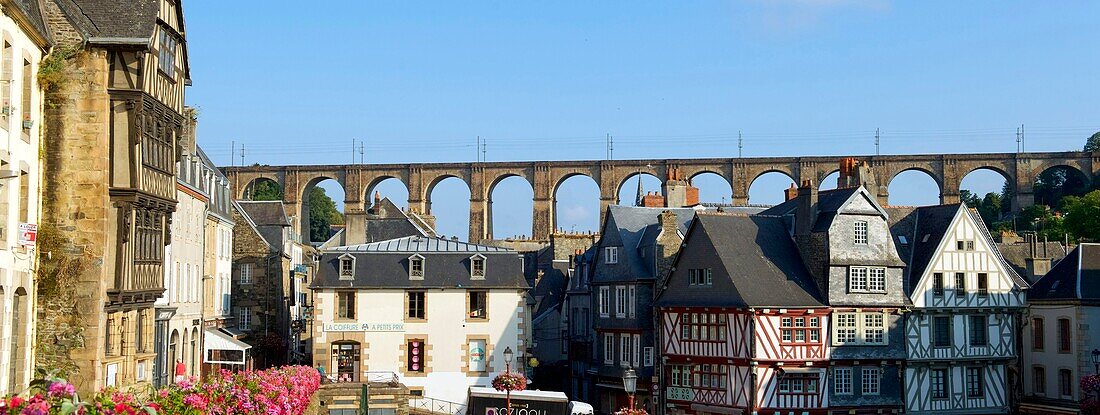 France, Finistere, Morlaix, place Allende, house of the Queen Anne, 16 th century half timbered house and the viaduct in the background