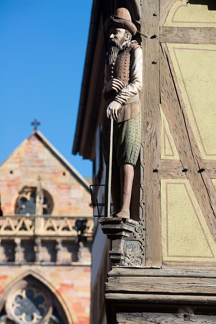 France, Haut Rhin, Alsace Wine Route, Colmar, house called Zum Kragen in rue des Marchands, the draper is carrying his height gauge