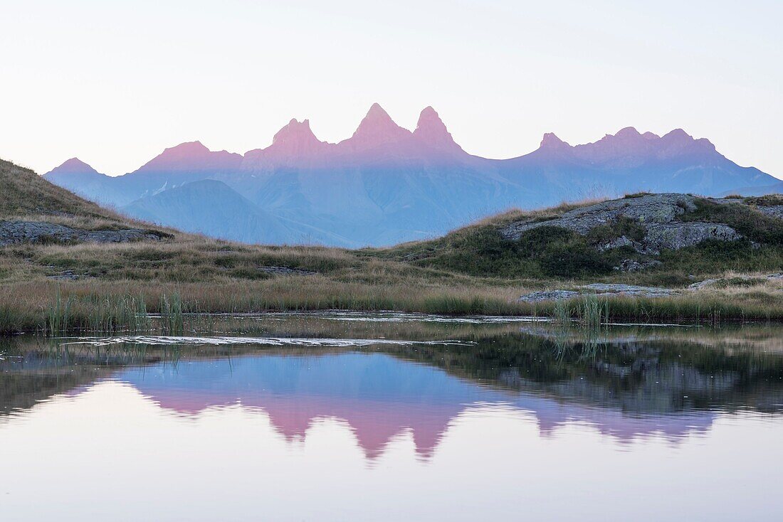 France, Savoie, Saint Jean de Maurienne, the largest cycling area in the world was created within a radius of 50 km around the city. At the cross of the Iron Cross, sunrise on the needles of Arves and Lake Guychard