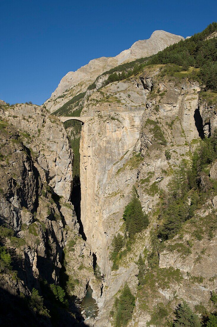 France, Alpes de Haute Provence, Ubaye massif, Saint Paul sur Ubaye, the bridge of Châtelet hung on two cliffs overhangs the torrent of Ubaye