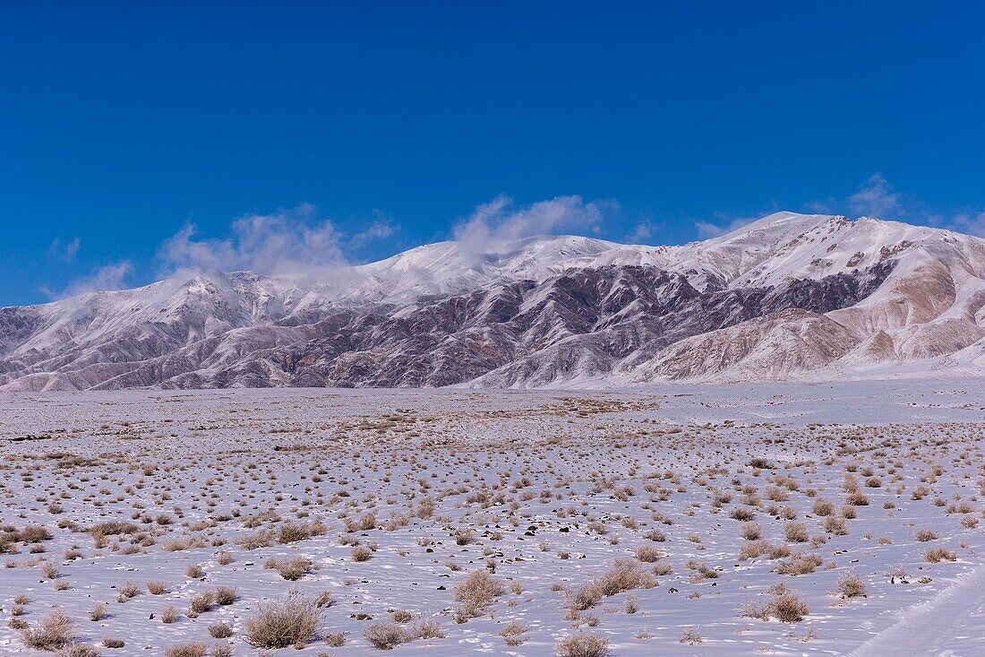 Mongolia, West Mongolia, Altai mountains, Valley with snow and rocks,