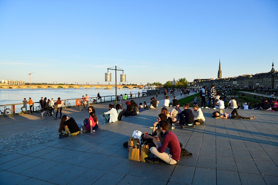 France, Gironde, Bordeaux, area classified as World Heritage, Marechal Lyautey quay, Pont de Pierre on Garonne River and Saint Michel basilica in the background