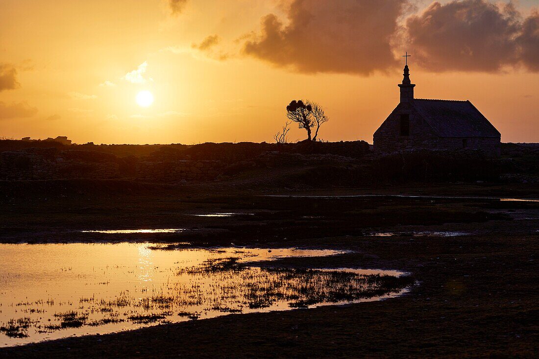 France, Finistere, Iroise Sea, Iles du Ponant, Parc Naturel Regional d'Armorique (Armorica Regional Natural Park), Ile de Sein, labelled Les Plus Beaux de France (The Most Beautiful Village of France), the Saint Corentin Chapel at sunset