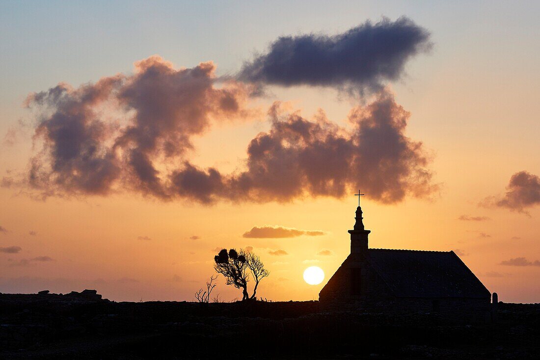 France, Finistere, Iroise Sea, Iles du Ponant, Parc Naturel Regional d'Armorique (Armorica Regional Natural Park), Ile de Sein, labelled Les Plus Beaux de France (The Most Beautiful Village of France), the Saint Corentin Chapel at sunset