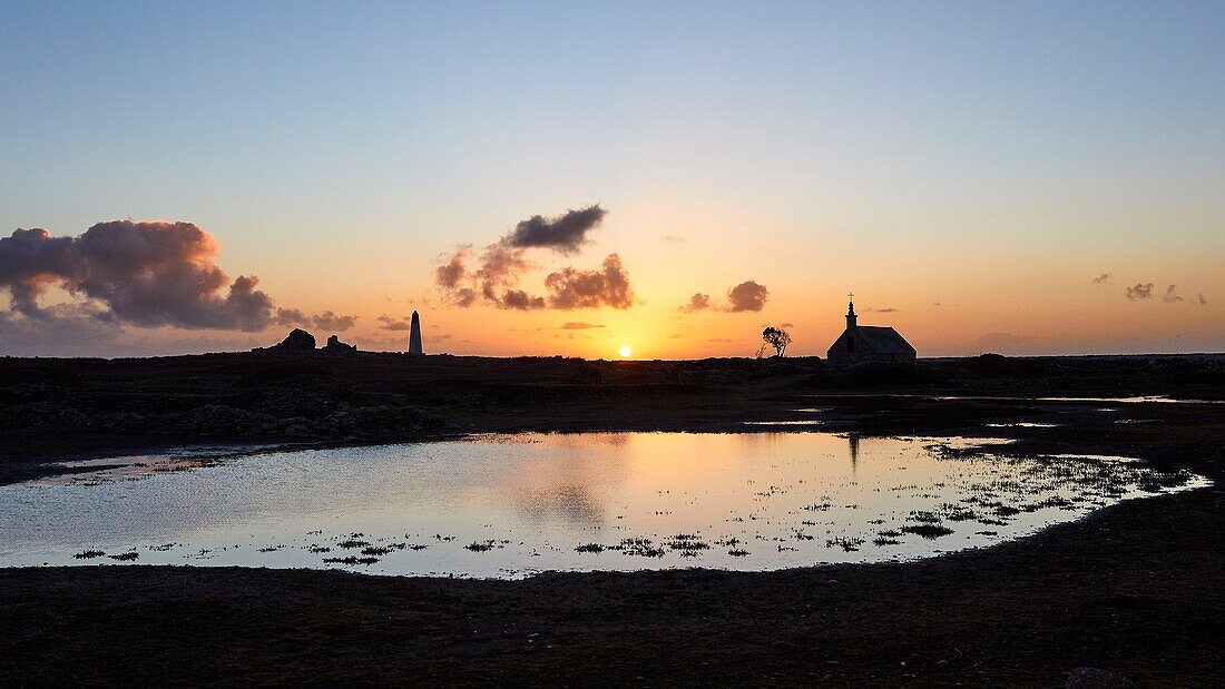 France, Finistere, Iroise Sea, Iles du Ponant, Parc Naturel Regional d'Armorique (Armorica Regional Natural Park), Ile de Sein, labelled Les Plus Beaux de France (The Most Beautiful Village of France), the Saint Corentin Chapel at sunset