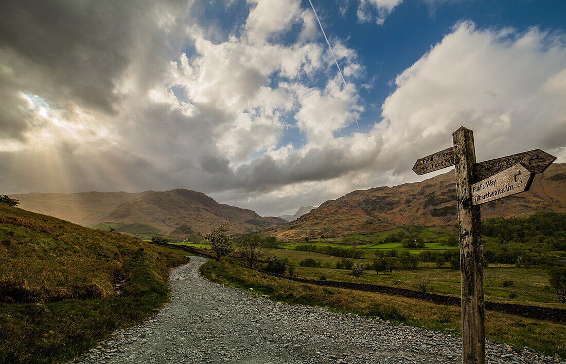 View towards distant Langdale Pikes and Little Langdale Tarn, taken from the Little Langdale Valley, Lake District National Park, UNESCO World Heritage Site, Cumbria, England, United Kingdom, Europe