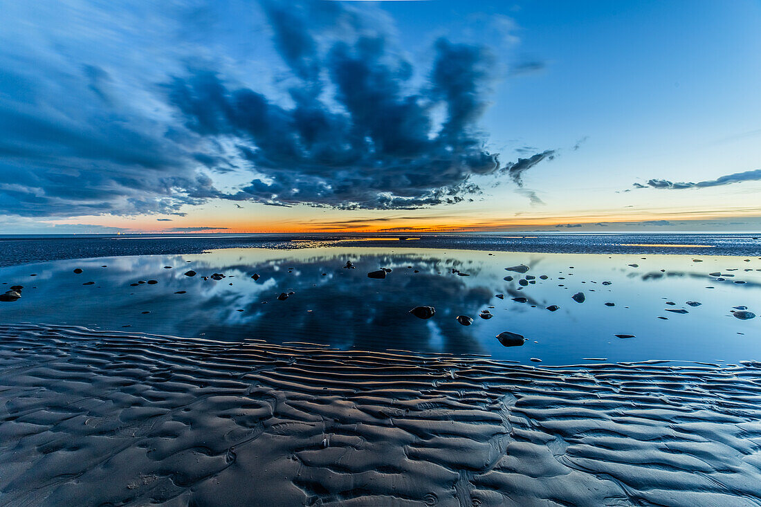 Sunset from Sandy Gap on Walney Island, view towards the distant Black Combe across the Irish Sea, Duddon Estuary and Cumbrian Coast, Walney Island, Lancashire, England, United Kingdom, Europe