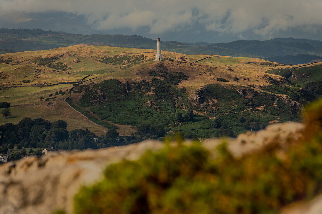 View towards the distant Sir John Barrow Monument situated on Hoad Hill, Ulverston, taken from Birkrigg Common, Ulverston, Cumbria, England, United Kingdom, Europe