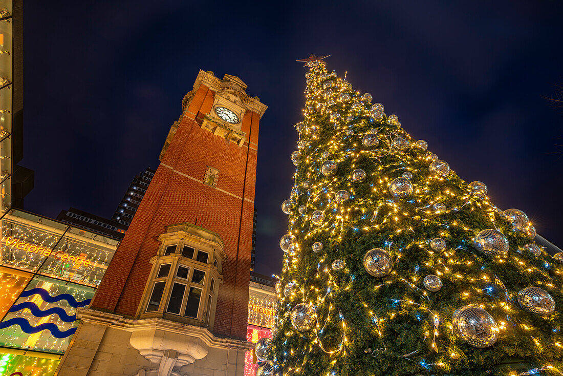View of Victoria Station Clock Tower and Christmas tree at dusk, Nottingham, Nottinghamshire, England, United Kingdom, Europe