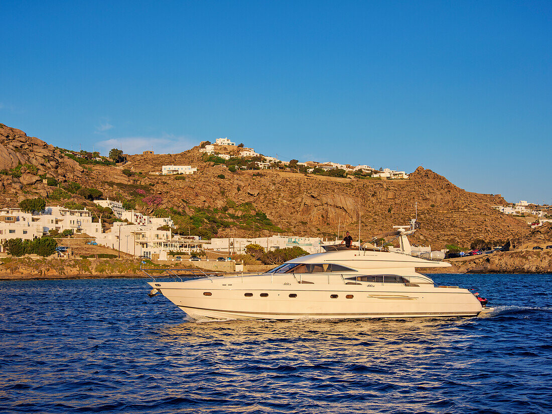 Yacht off the coast of Mykonos Town, Mykonos Island, Cyclades, Greek Islands, Greece, Europe