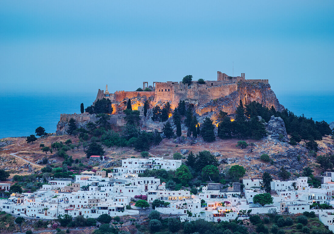 View towards the Acropolis of Lindos at dusk, Rhodes Island, Dodecanese, Greek Islands, Greece, Europe