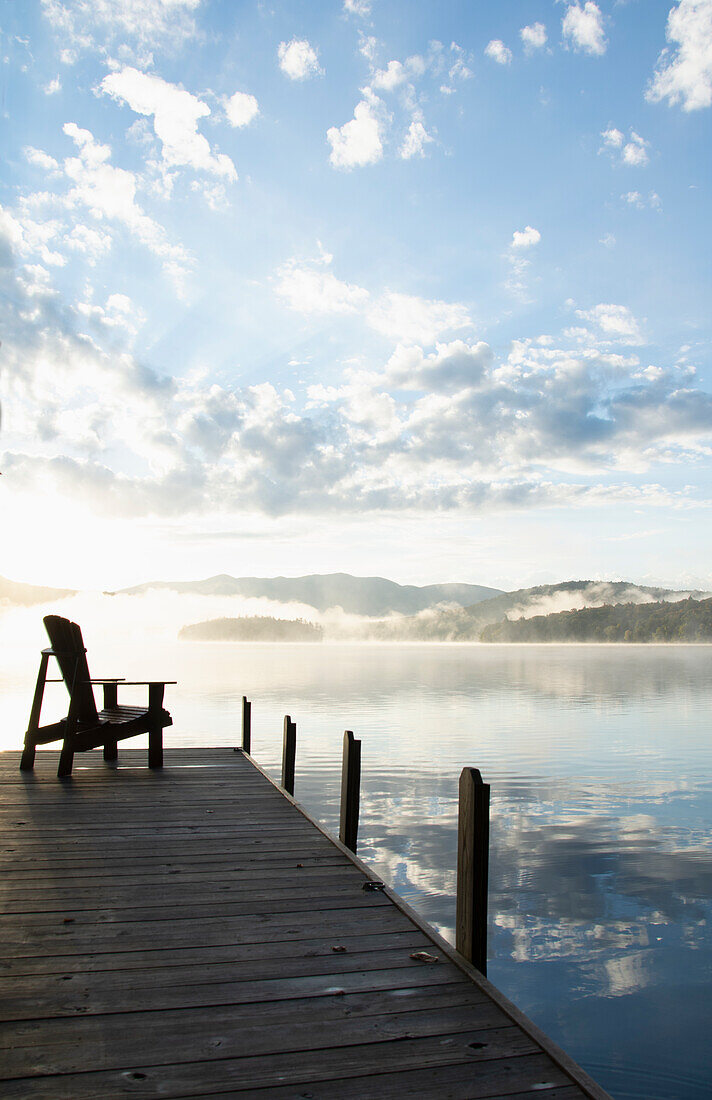 Boat dock at sunrise, Lake Placid, New York, USA