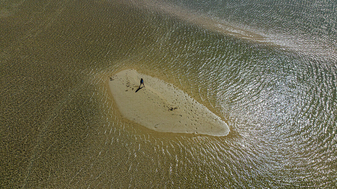 Aerial of a girl walking on a sandbank, Langebaan Lagoon Marine Protected Area, West Coast National Park, Western Cape Province, South Africa, Africa