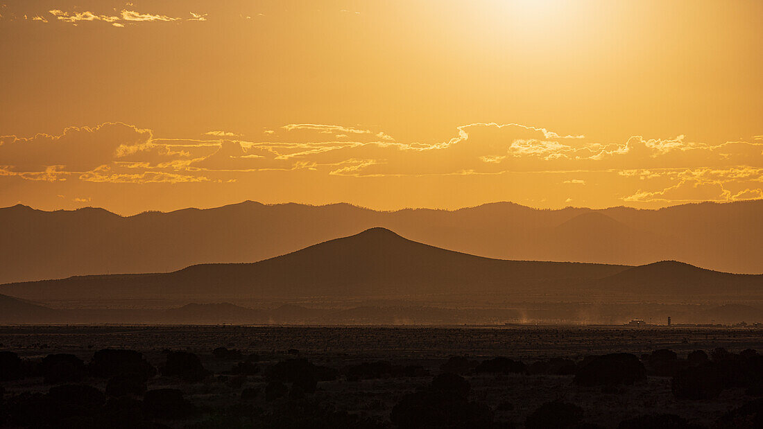 USA, New Mexico, Santa Fe, Desert landscape at sunset during heat wave