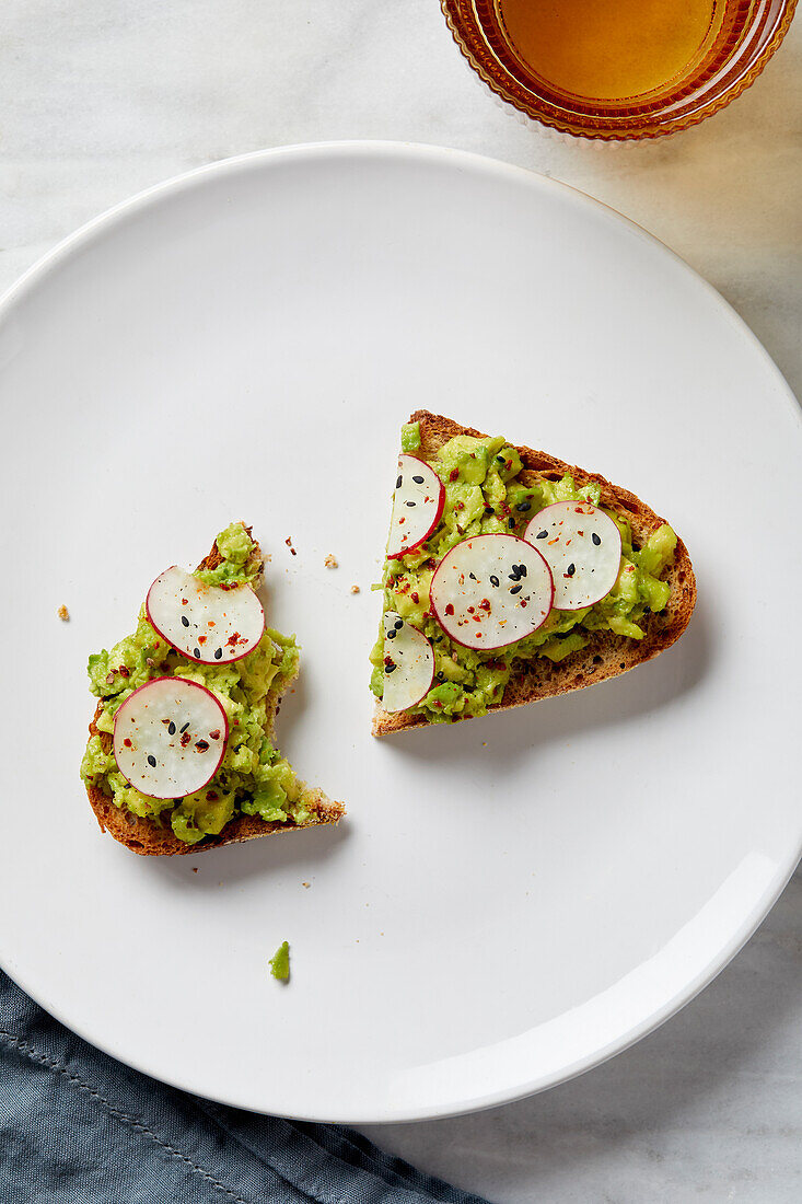 Overhead view of avocado toast on plate