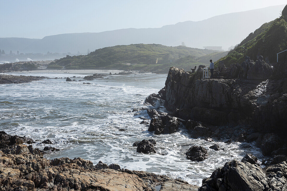 South Africa, Hermanus, Rocky coastline and sea at Kammabaai Beach