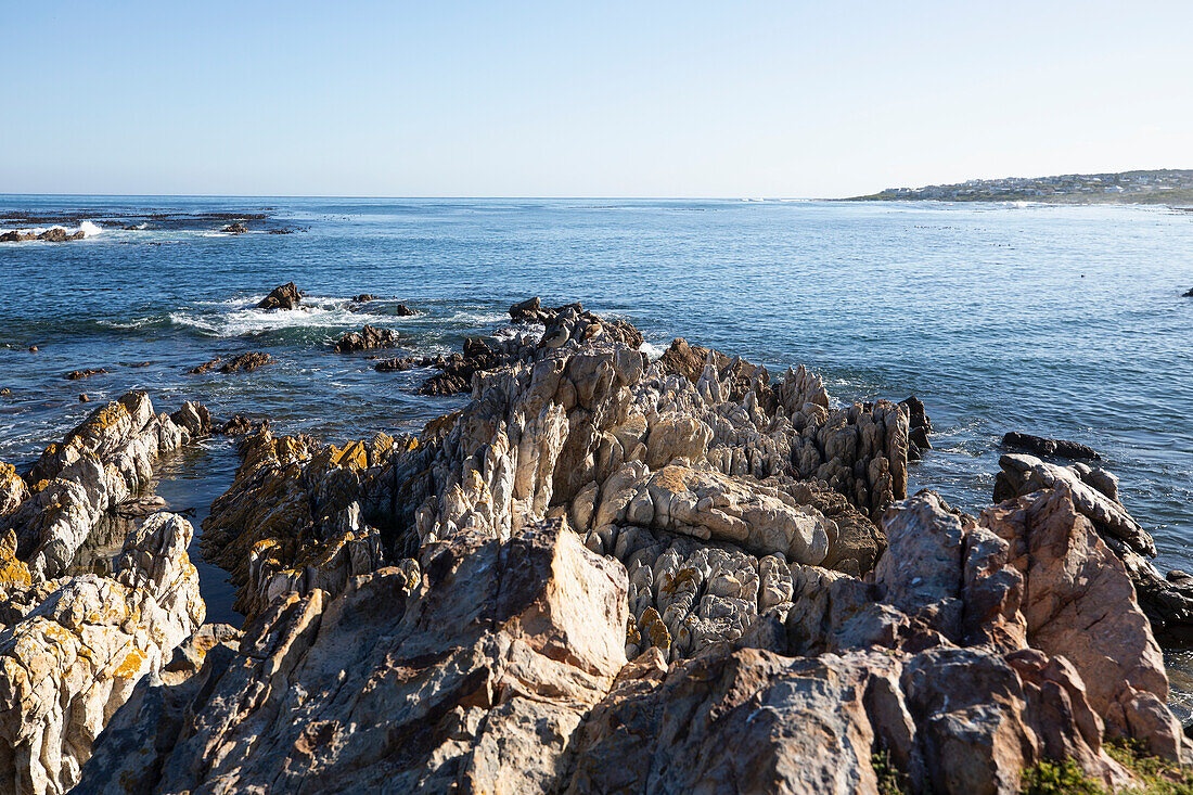 South Africa, Rocky coast and Onrus Beach at sunny day