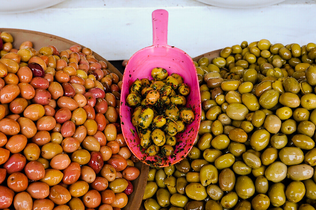 Bowls of cured olives for sale at the Medina souk. Marrakech, Morocco.