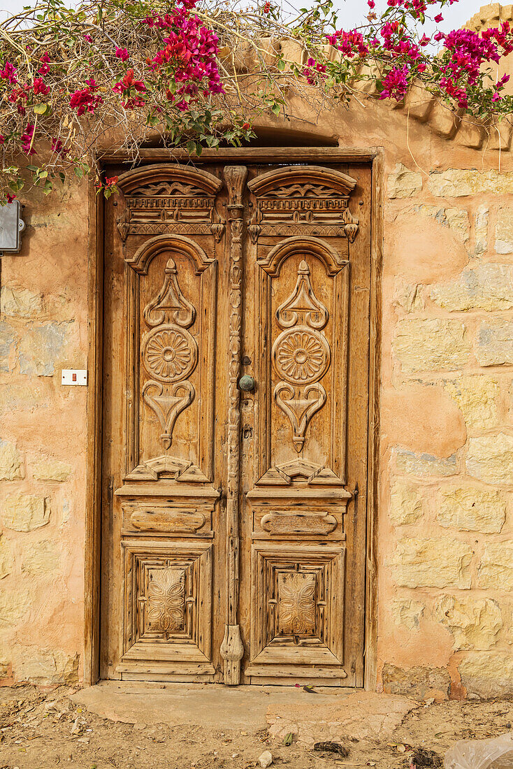 Faiyum, Egypt. Wooden door in a wall.