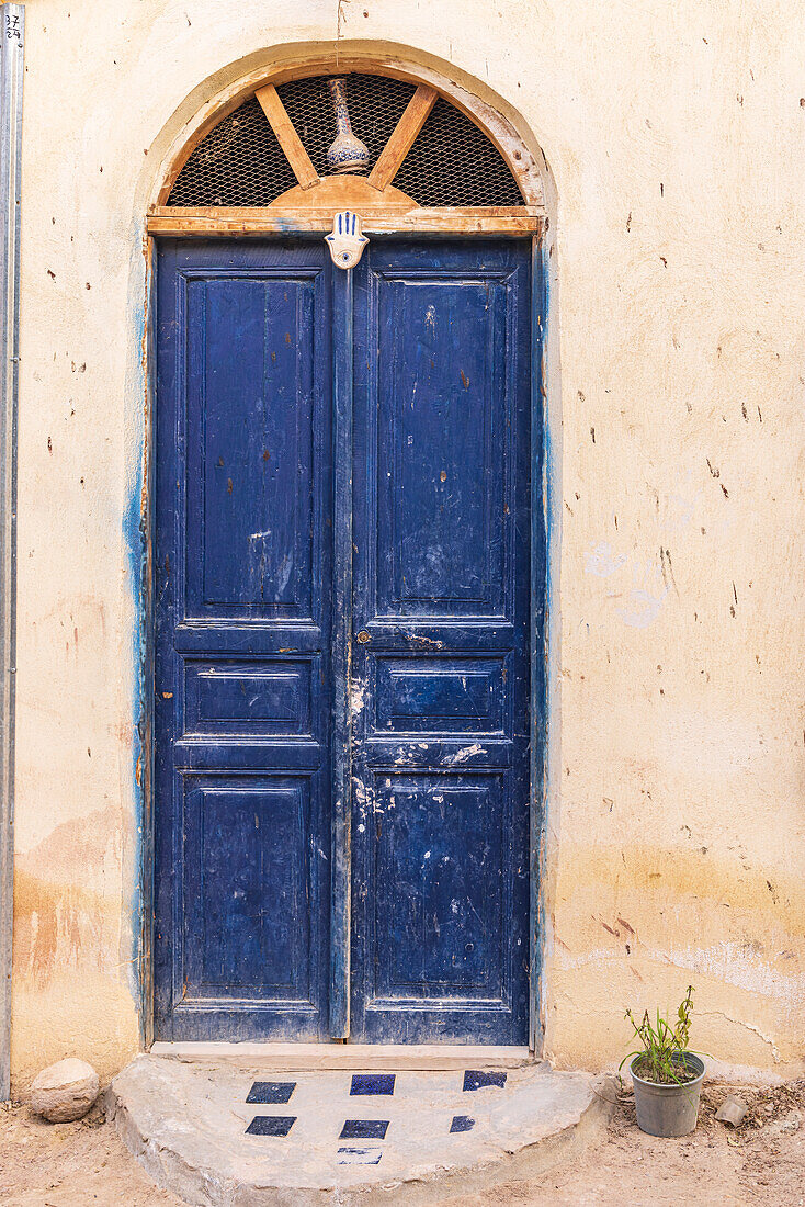 Faiyum, Egypt. A blue painted door on a building.