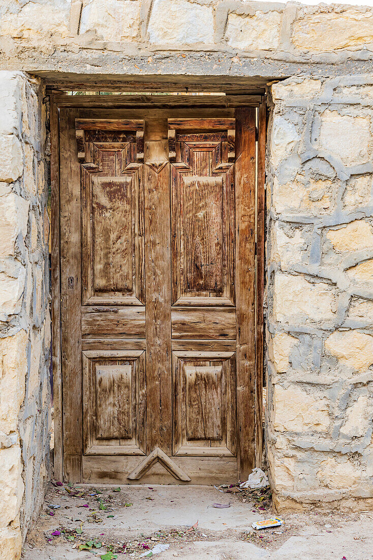 Faiyum, Egypt. Wooden door in a wall.