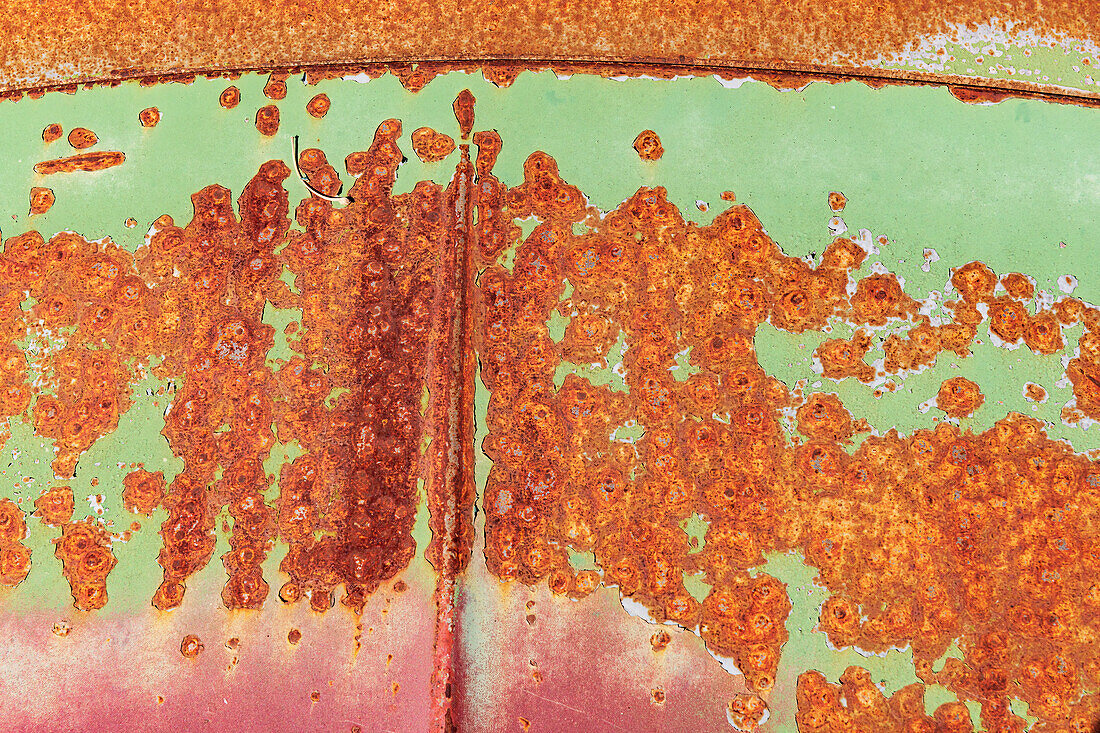 Canada, Manitoba, St. Lupicin. Close-up of rusted paint patterns on vintage car.