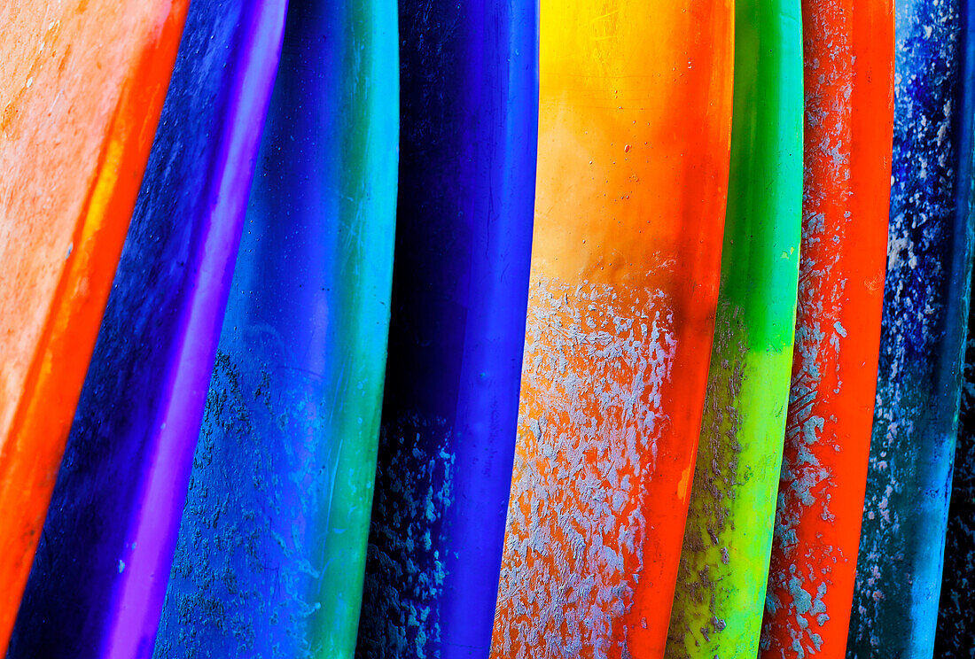 Stacked surf boards at sunset after a day of surf school in Canggu, Bali, Indonesia