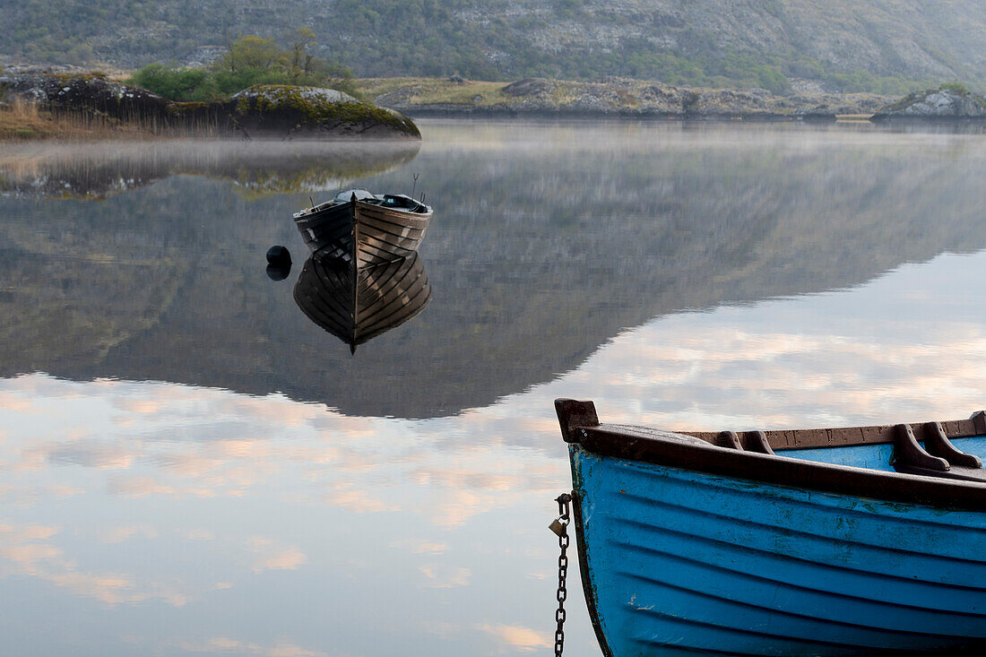 Ireland, Lough Leane. Boats and reflections on lake.