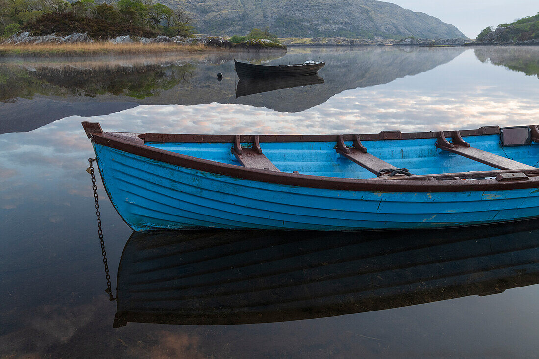 Ireland, Lough Leane. Boats and reflections on lake.