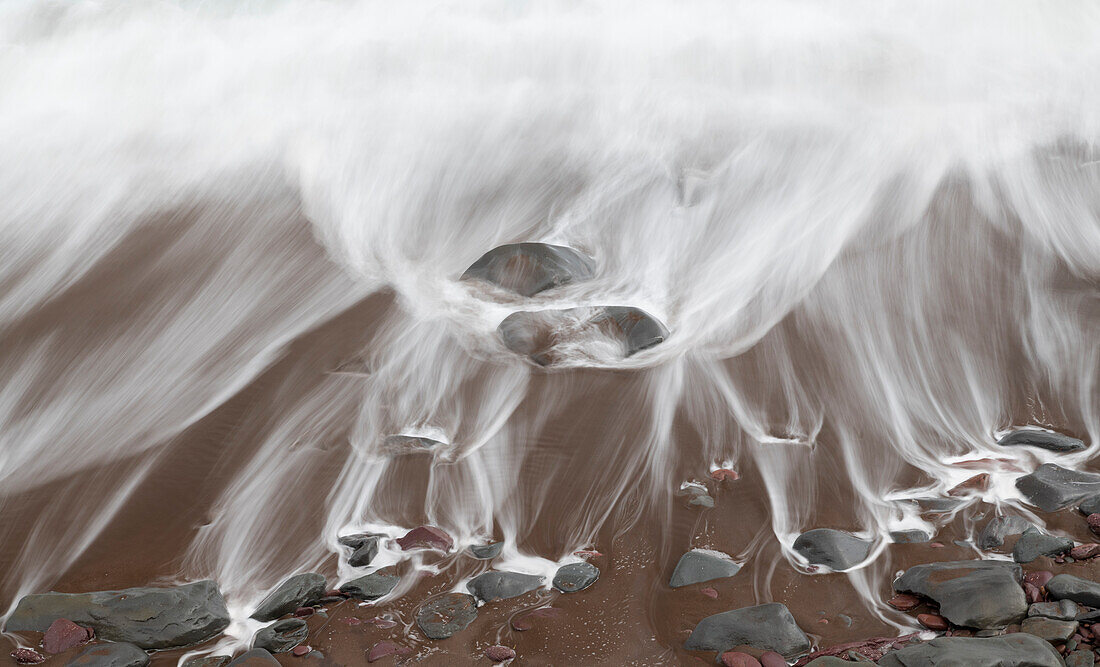 Ireland, Kinnard Beach. Close-up abstract of wave on beach.