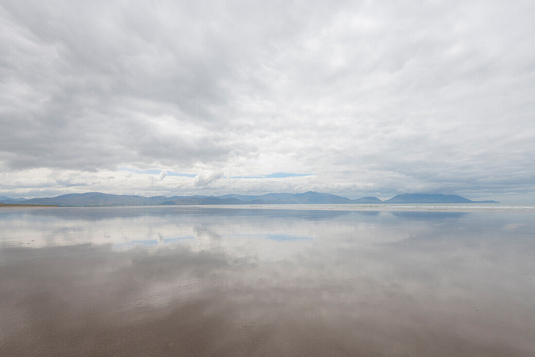 Ireland, Inch Strand. Landscape with fog on ocean and beach.