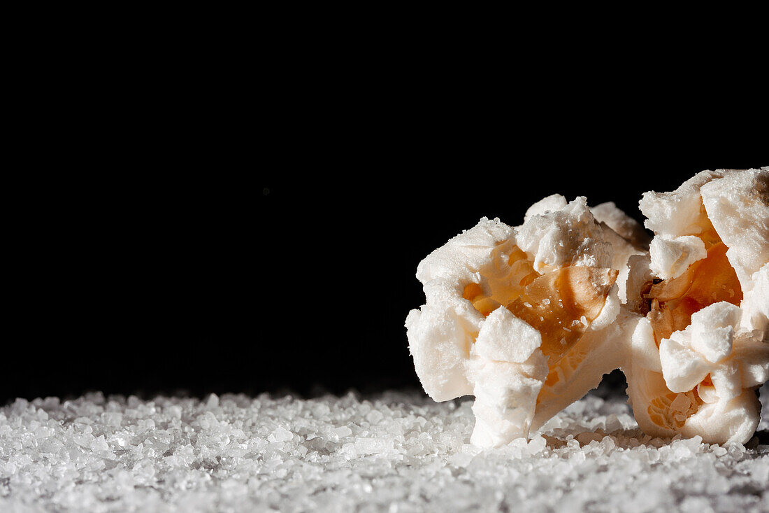 Closeup of a delicious popcorn on a layer of salt