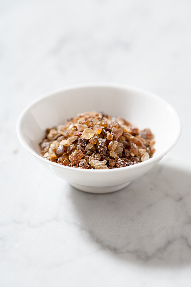 Brown sugar candy in a white bowl