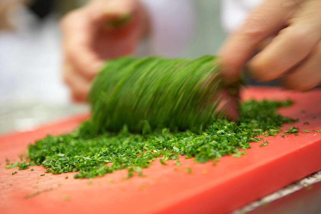 Chop the parsley on a chopping board